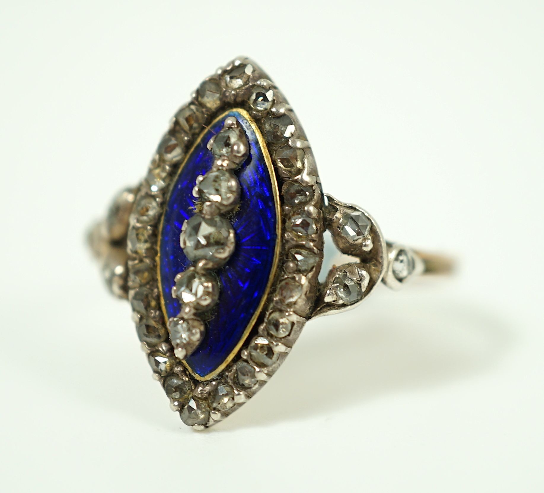 An 19th century gold, rose cut diamond and blue guilloche enamel set marquise shaped ring